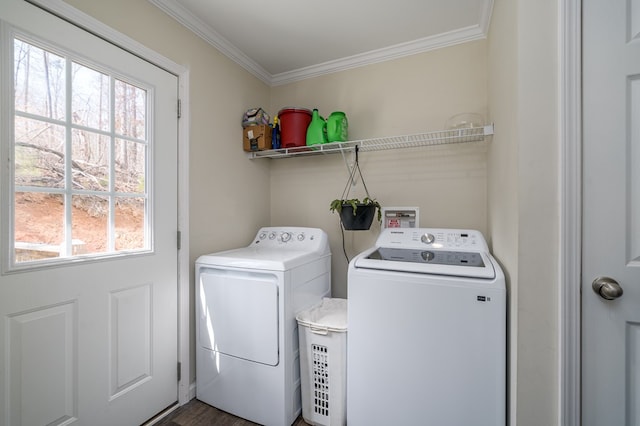 washroom with laundry area, ornamental molding, and separate washer and dryer