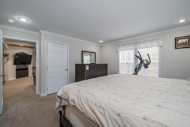 carpeted bedroom with baseboards, recessed lighting, and crown molding