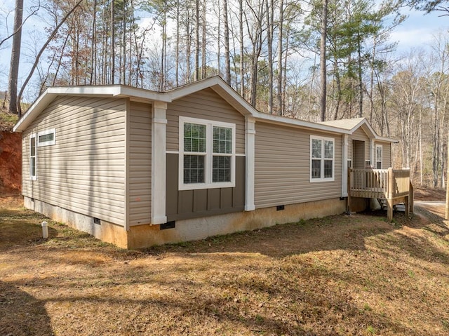 view of property exterior with crawl space