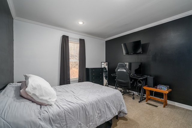 carpeted bedroom featuring baseboards and crown molding