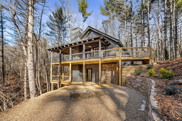 view of front of home featuring a wooden deck