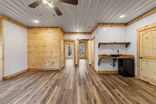 interior space with wood-type flooring and ornamental molding