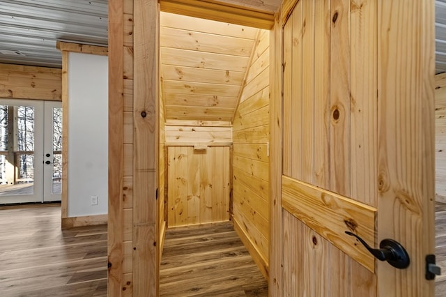 details with hardwood / wood-style flooring, wood walls, and wood ceiling