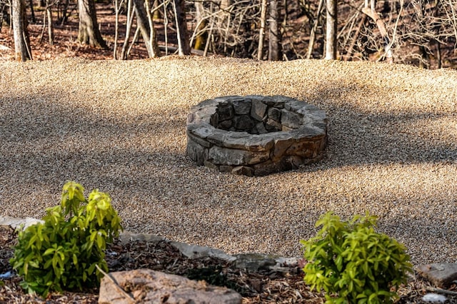 exterior details with an outdoor fire pit