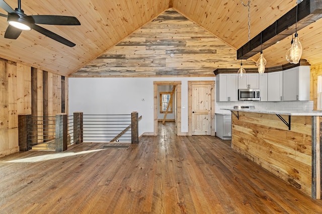 kitchen featuring pendant lighting, white cabinets, tasteful backsplash, wooden ceiling, and high vaulted ceiling