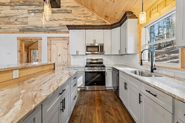 kitchen with hanging light fixtures, dark hardwood / wood-style flooring, sink, wooden ceiling, and stainless steel appliances