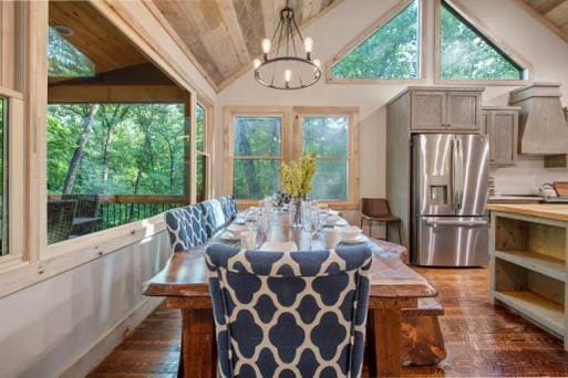 241 Lees Ride, Mccaysville, GA 30555 - dining room with wood-type flooring, vaulted ceiling, a chandelier, wooden ceiling, and plenty of natural light