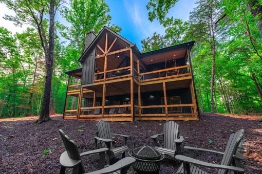 241 Lees Ride, Mccaysville, GA 30555 - back of house featuring a chimney, a fire pit, and a wooden deck