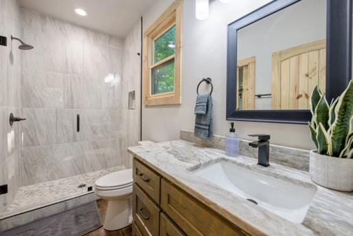 241 Lees Ride, Mccaysville, GA 30555 - bathroom with a shower stall, toilet, vanity, and wood finished floors
