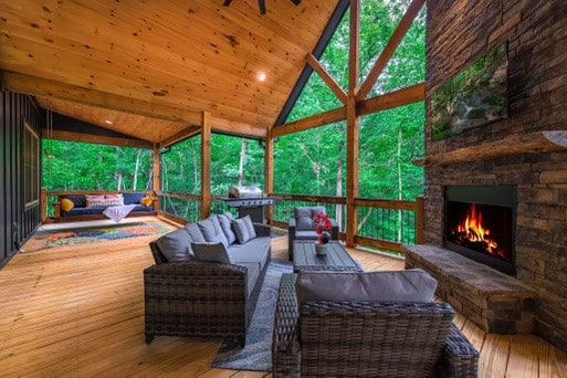 241 Lees Ride, Mccaysville, GA 30555 - sunroom / solarium featuring an outdoor living space with a fireplace and lofted ceiling