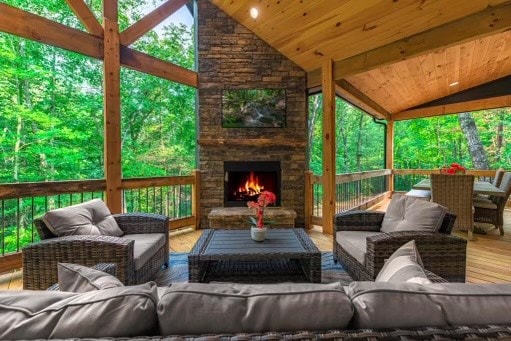 241 Lees Ride, Mccaysville, GA 30555 - sunroom featuring lofted ceiling and an outdoor living space with a fireplace