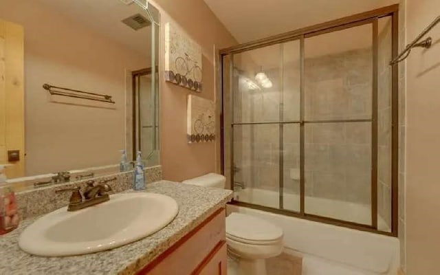 600 Mill Ridge Rd, Hiawassee, GA 30546 - bathroom featuring toilet, visible vents, combined bath / shower with glass door, and vanity