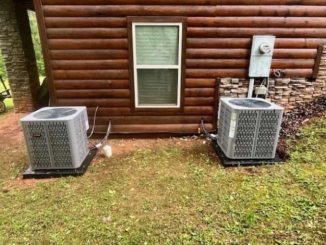 600 Mill Ridge Rd, Hiawassee, GA 30546 - details with central AC unit and faux log siding