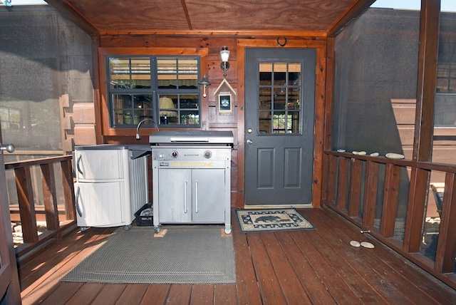 kitchen featuring refrigerator and hardwood / wood-style floors