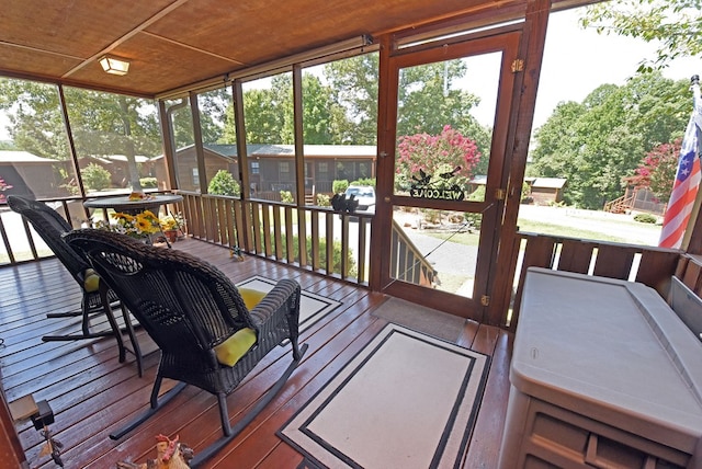 sunroom featuring wood ceiling