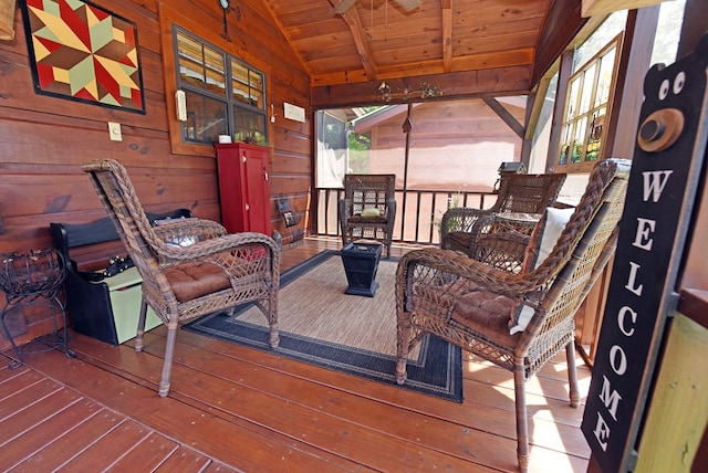 wooden terrace with an outdoor hangout area