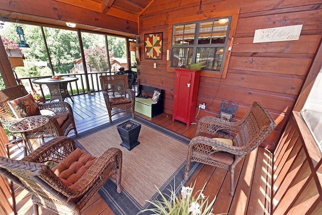 sunroom featuring lofted ceiling