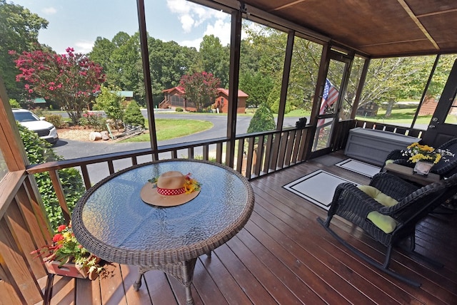 wooden terrace featuring covered porch