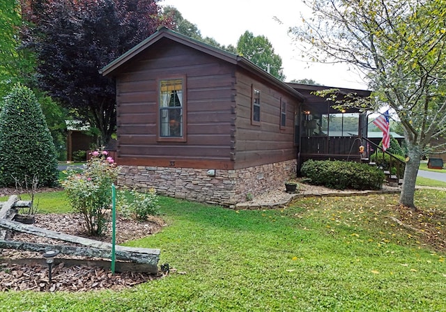 view of home's exterior with a lawn