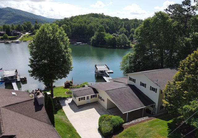 birds eye view of property featuring a water and mountain view