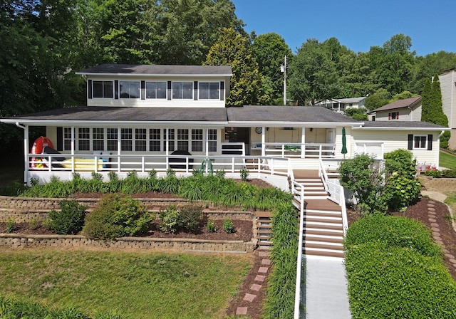 view of front of property featuring a porch and stairway