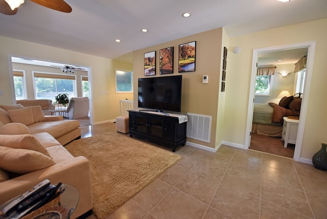 living room with visible vents, baseboards, a ceiling fan, and recessed lighting