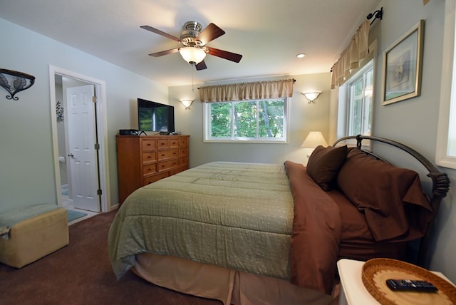 bedroom featuring ceiling fan, connected bathroom, and carpet floors