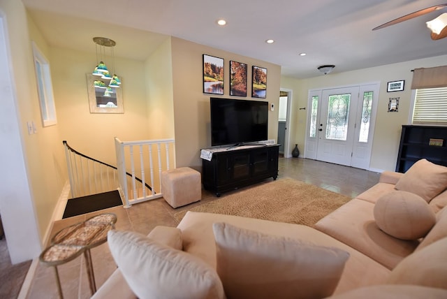 living room with recessed lighting, tile patterned floors, baseboards, and a ceiling fan