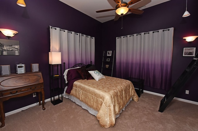 bedroom with carpet flooring, baseboards, and ceiling fan