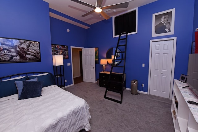 bedroom with baseboards, high vaulted ceiling, carpet flooring, and ceiling fan