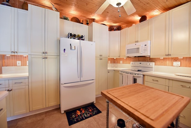 kitchen with white appliances, light tile patterned floors, light countertops, a ceiling fan, and wooden ceiling