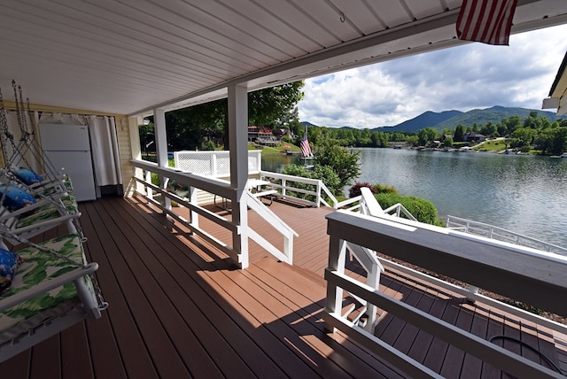 deck featuring a water and mountain view