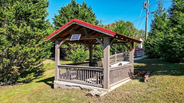 deck with a yard and a gazebo