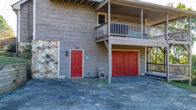 rear view of house featuring a balcony