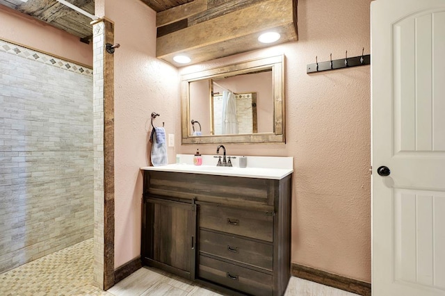 bathroom with vanity and walk in shower