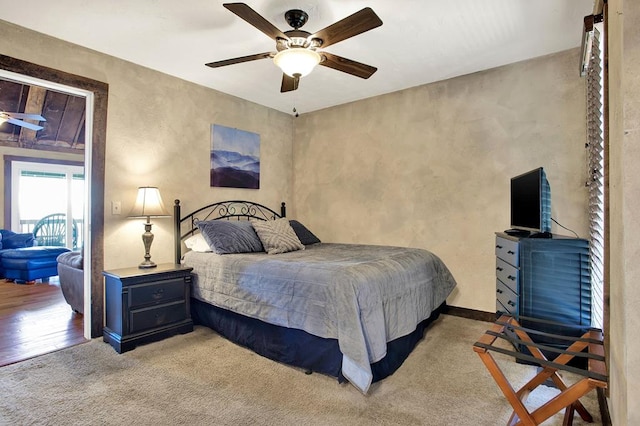 bedroom with light wood-type flooring and ceiling fan