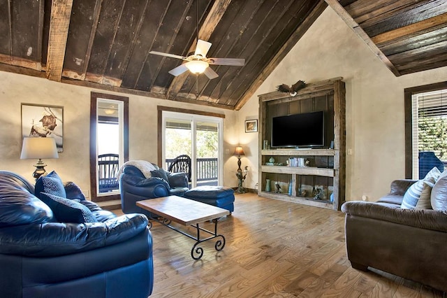 living room featuring wood ceiling, ceiling fan, wood-type flooring, and a wealth of natural light