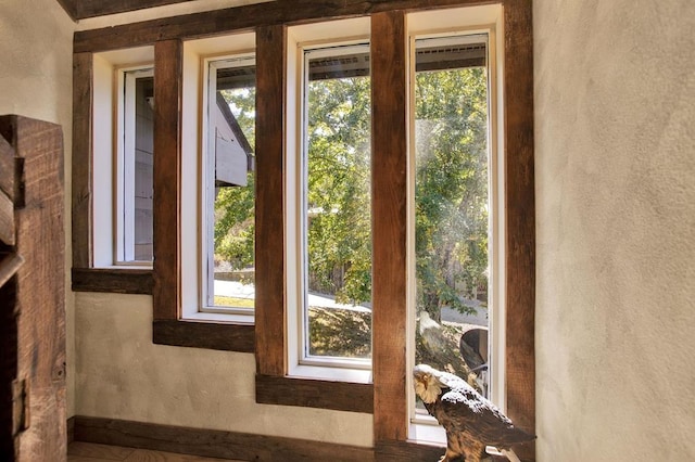 doorway to outside featuring plenty of natural light