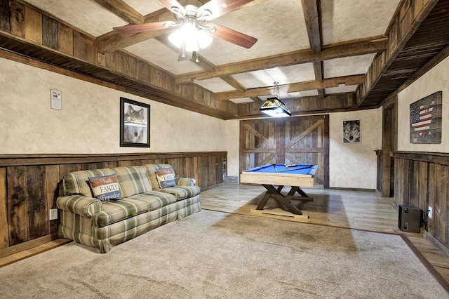 game room featuring beamed ceiling, coffered ceiling, pool table, and wood walls