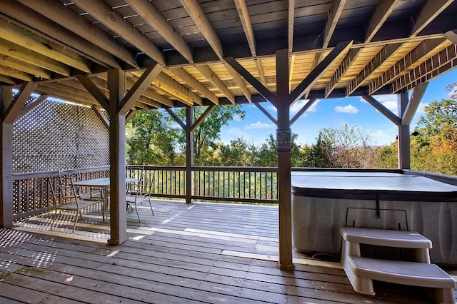 deck featuring a hot tub