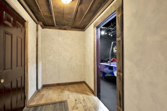 hall with wood ceiling and hardwood / wood-style flooring