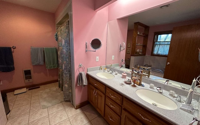 bathroom with vanity, tile patterned flooring, and heating unit