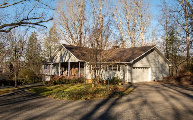 view of front of property with a garage and covered porch