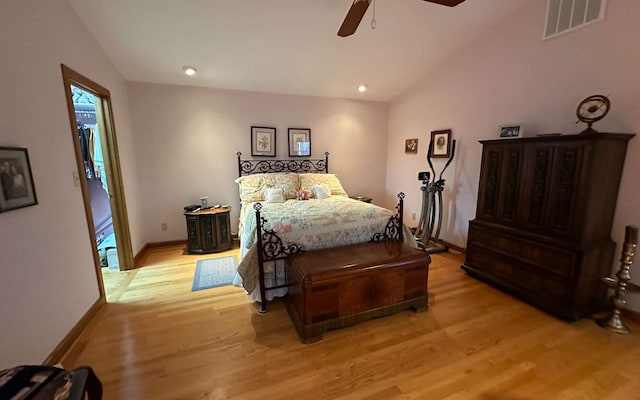 bedroom featuring lofted ceiling, ceiling fan, and light hardwood / wood-style flooring