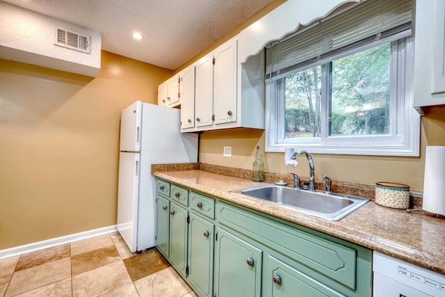 kitchen featuring white cabinets, white appliances, green cabinetry, a textured ceiling, and sink