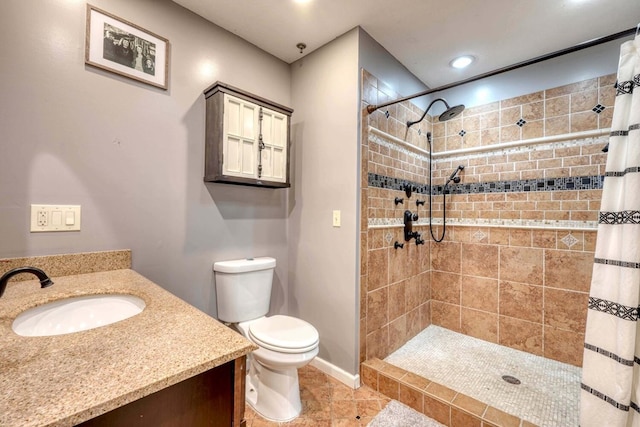 bathroom featuring vanity, toilet, tile patterned floors, and a shower with curtain