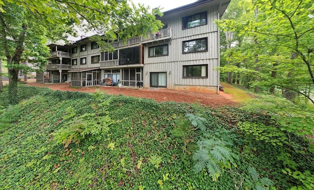 back of property featuring a balcony