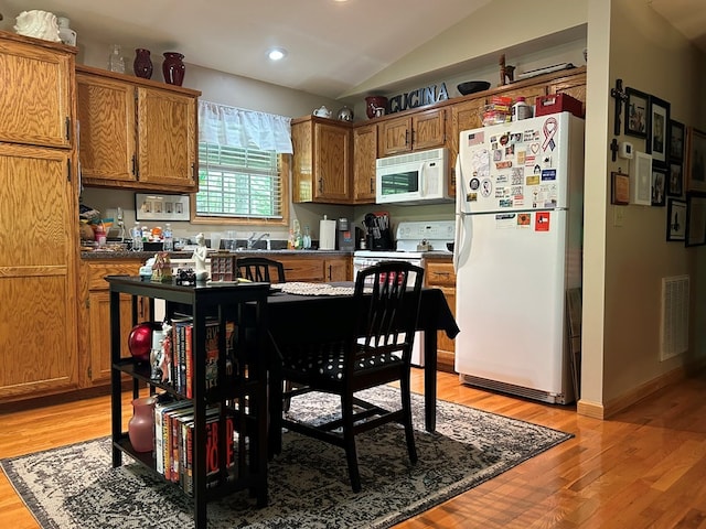 45 Settlers Crossing Way, Murphy, NC 28906 - kitchen featuring light wood-type flooring, brown cabinetry, white appliances, and visible vents