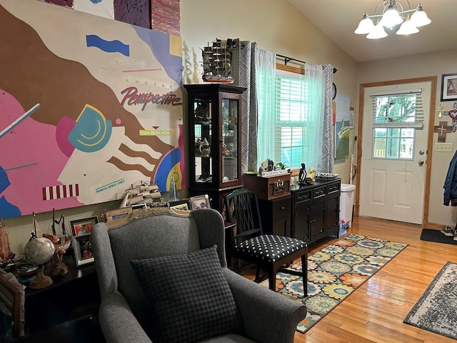45 Settlers Crossing Way, Murphy, NC 28906 - living area featuring lofted ceiling, wood finished floors, and a notable chandelier