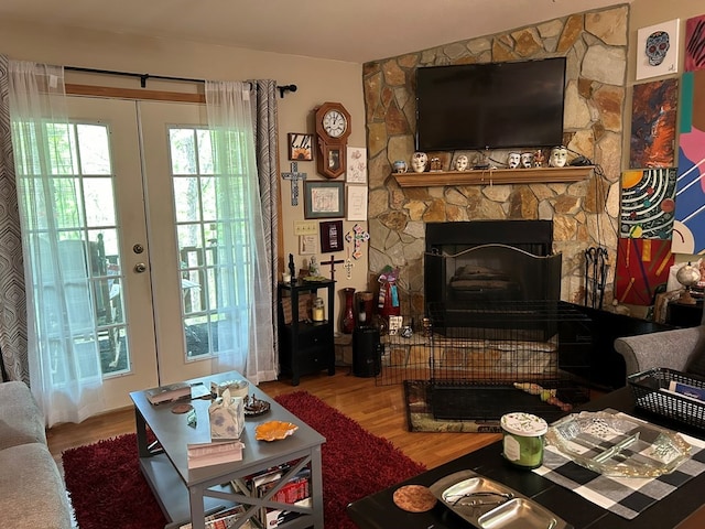 45 Settlers Crossing Way, Murphy, NC 28906 - living area featuring french doors, wood finished floors, and a stone fireplace